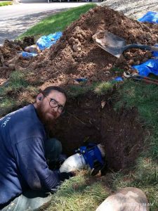 plumber conducting trenchless repairs