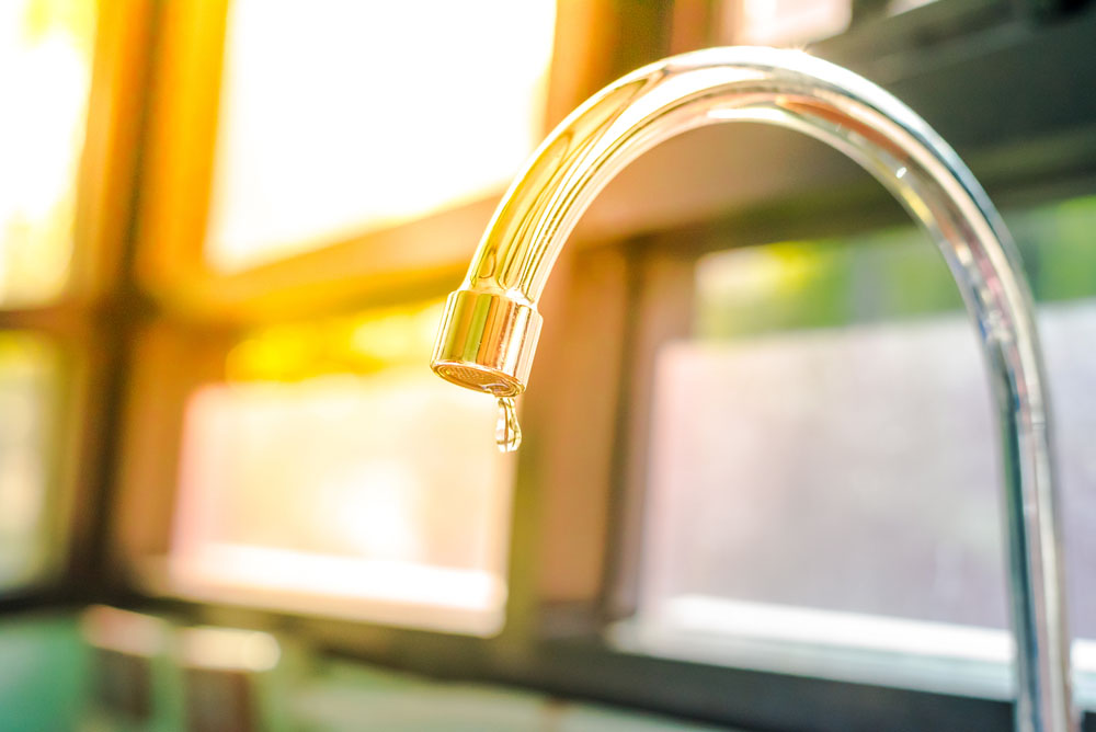 water dripping from a leaky faucet